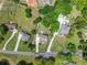 Aerial shot of the house showcasing the landscaped lot and neighborhood at 592 Hayes Rd, Auburn, GA 30011