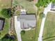 Overhead shot of the house featuring manicured lawns, landscaping and a concrete patio with furniture at 592 Hayes Rd, Auburn, GA 30011