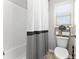 Well-lit bathroom with updated features including a toilet, window, and shower at 592 Hayes Rd, Auburn, GA 30011