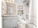 Bright and modern bathroom features decorative shelves and a shower at 592 Hayes Rd, Auburn, GA 30011