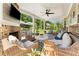 Close up of covered patio with fireplace and outdoor seating at 592 Hayes Rd, Auburn, GA 30011