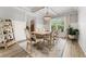 Elegant dining room featuring a chandelier, wainscoting, and lots of natural light at 592 Hayes Rd, Auburn, GA 30011