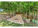Landscaped walkway leads to a hidden fire pit area at 592 Hayes Rd, Auburn, GA 30011