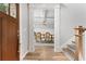 Elegant foyer with hardwood floors, staircase, and open view into the dining room at 592 Hayes Rd, Auburn, GA 30011