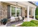 Cozy front porch featuring comfortable seating, perfect for relaxing and enjoying the neighborhood at 592 Hayes Rd, Auburn, GA 30011