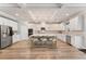 Bright, spacious kitchen with white cabinets, stainless steel appliances, and a large center island at 592 Hayes Rd, Auburn, GA 30011
