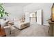 Upstairs living room with neutral colors, plush carpet and filled with light at 592 Hayes Rd, Auburn, GA 30011