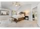 Serene main bedroom featuring a vaulted ceiling, plush carpet, and elegant furnishings at 592 Hayes Rd, Auburn, GA 30011