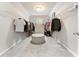 Spacious walk-in closet featuring ample shelving, and carpeted floors at 592 Hayes Rd, Auburn, GA 30011