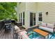 Inviting back deck with stylish seating, barbecue grill, and access to the home's interior at 1667 Willow Way, Woodstock, GA 30188