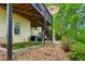 Exterior view of home highlighting a deck, hot tub, and well-maintained backyard at 1667 Willow Way, Woodstock, GA 30188