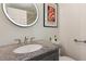 Contemporary bathroom featuring modern fixtures and a granite countertop at 1667 Willow Way, Woodstock, GA 30188