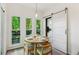 Bright breakfast nook with three windows, sliding barn door and views of the deck at 1667 Willow Way, Woodstock, GA 30188