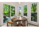 Breakfast nook with access to back deck, three windows and outdoor dining furniture at 1667 Willow Way, Woodstock, GA 30188