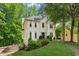 Well-maintained two-story home featuring mature trees, inviting landscape, and a spacious driveway at 1667 Willow Way, Woodstock, GA 30188
