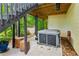 Outdoor patio featuring a modern hot tub, seating, and the home's exterior at 1667 Willow Way, Woodstock, GA 30188