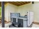 Modern hot tub with cover open on a concrete patio with steps and ambient lighting at 1667 Willow Way, Woodstock, GA 30188