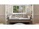 Bright living room featuring built in shelving and a comfortable neutral colored couch at 1667 Willow Way, Woodstock, GA 30188