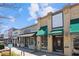 Street view of local Antiques and other stores, featuring awnings and pedestrian access at 1667 Willow Way, Woodstock, GA 30188