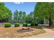 Tennis court area with benches and well-maintained landscaping for community enjoyment at 1667 Willow Way, Woodstock, GA 30188