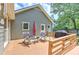 Back deck featuring rocking chairs, table, and grill at 4546 Windsor Oaks Ct, Marietta, GA 30066