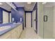Detailed bathroom with double sinks, tiled floors, and a glass-enclosed shower, offering a modern and clean look at 4546 Windsor Oaks Ct, Marietta, GA 30066