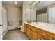 Bathroom with double sink vanity, tile floor, and shower with neutral and green shower curtain at 4546 Windsor Oaks Ct, Marietta, GA 30066