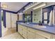 Bathroom featuring double sinks, vanity lighting, and a glass shower, creating a functional space at 4546 Windsor Oaks Ct, Marietta, GA 30066