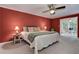 Spacious bedroom with red walls and a sunroom area, offering a cozy and bright atmosphere at 4546 Windsor Oaks Ct, Marietta, GA 30066