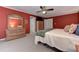 Comfortable bedroom with hardwood floors, a ceiling fan, and ample closet space, perfect for relaxation at 4546 Windsor Oaks Ct, Marietta, GA 30066