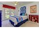 Inviting bedroom with bright windows, a vibrant quilt, and cheerful decor, creating a cozy and colorful retreat at 4546 Windsor Oaks Ct, Marietta, GA 30066