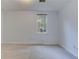 Carpeted bedroom with neutral paint color and double-hung window at 4546 Windsor Oaks Ct, Marietta, GA 30066