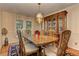 Elegant dining room with hardwood floors, chandelier, and classic wooden furniture at 4546 Windsor Oaks Ct, Marietta, GA 30066