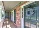 Welcoming front door adorned with a decorative wreath, complemented by brick accents and classic design at 4546 Windsor Oaks Ct, Marietta, GA 30066
