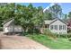 Attractive home showcasing a well-kept lawn, lovely landscaping, and an attached two-car garage at 4546 Windsor Oaks Ct, Marietta, GA 30066