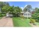 Beautiful home with well-maintained landscaping, lush greenery, and a double garage at 4546 Windsor Oaks Ct, Marietta, GA 30066