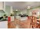 Spacious kitchen with hardwood floors, white cabinetry, and black countertops at 4546 Windsor Oaks Ct, Marietta, GA 30066