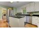 Cozy kitchen with a central island, stainless steel appliances, and wood flooring at 4546 Windsor Oaks Ct, Marietta, GA 30066