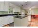 Bright kitchen with white cabinetry, stainless steel appliances, and hardwood floors at 4546 Windsor Oaks Ct, Marietta, GA 30066