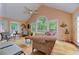 Open living room with vaulted ceiling, large windows, and comfortable seating at 4546 Windsor Oaks Ct, Marietta, GA 30066