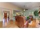 Spacious living room boasts hardwood floors, brick fireplace, and seamless flow to other rooms at 4546 Windsor Oaks Ct, Marietta, GA 30066