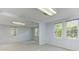 Large carpeted space with neutral paint and multiple windows at 4546 Windsor Oaks Ct, Marietta, GA 30066
