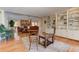 Open concept living room features hardwood floors, brick fireplace, and built-in bookshelves at 4546 Windsor Oaks Ct, Marietta, GA 30066