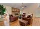 Open living room with brick fireplace, hardwood floors, and comfortable seating at 4546 Windsor Oaks Ct, Marietta, GA 30066