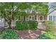 Charming front porch featuring classic railings, brick accents, and lush landscaping at 4546 Windsor Oaks Ct, Marietta, GA 30066