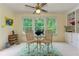 Bright sunroom with large windows and a decorative fish statue, offering scenic views of the outdoors at 4546 Windsor Oaks Ct, Marietta, GA 30066