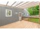 Wooden back porch with partial roof and view of the backyard at 947 Rebel Forest Dr, Atlanta, GA 30315