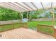 Wooden back porch overlooking backyard featuring a storage shed and wooden privacy fence at 947 Rebel Forest Dr, Atlanta, GA 30315