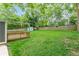 A spacious backyard with a wooden deck, wooden privacy fence and storage shed at 947 Rebel Forest Dr, Atlanta, GA 30315