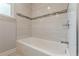 Bright bathtub featuring modern tiling and fixtures, creating a relaxing atmosphere at 947 Rebel Forest Dr, Atlanta, GA 30315